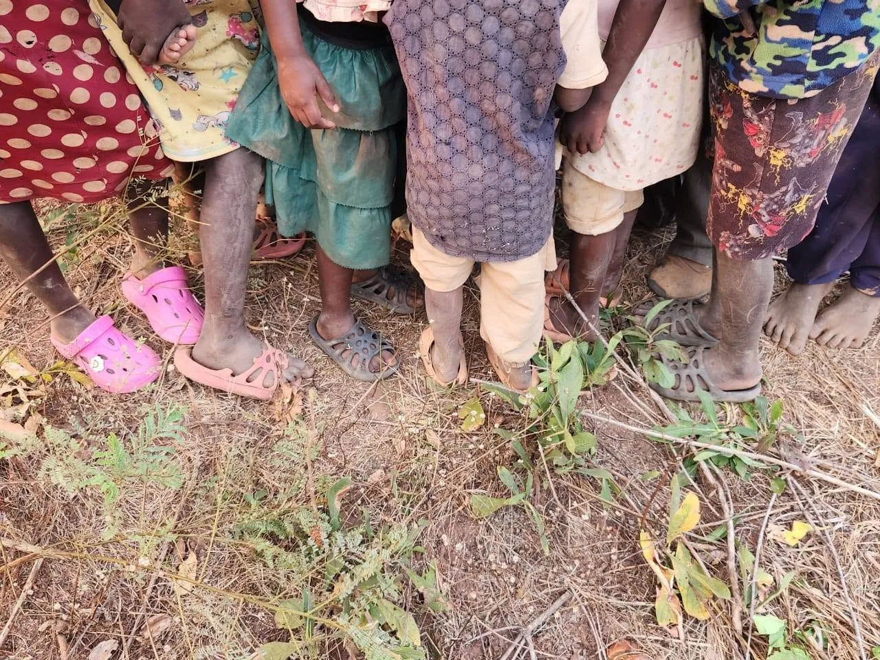 A group of children standing together outdoors